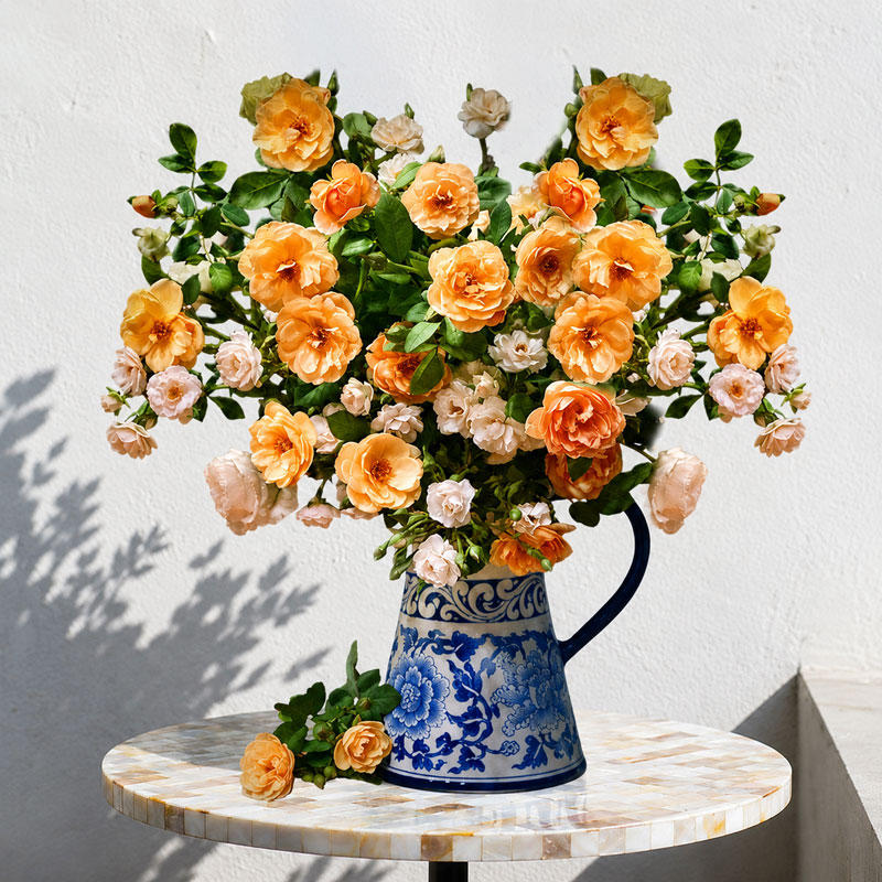 Decorating Tables with a Blue and White Ceramic Flower Vase and Orange Roses