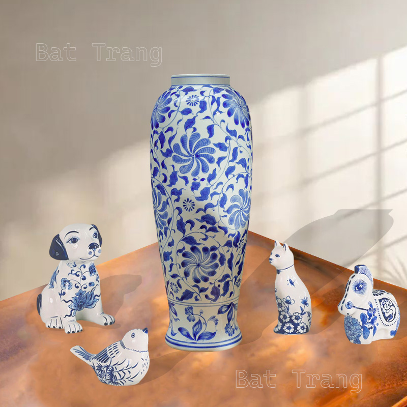 Handcrafted blue and white ceramic vase with a winding floral pattern.