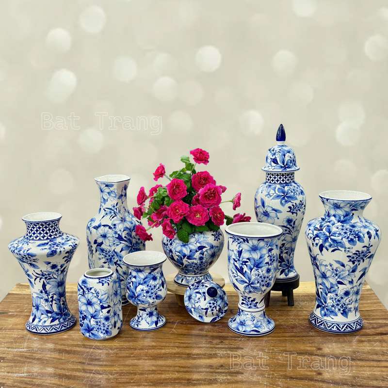 Set of traditional blue and white ceramic vases with hand-painted lilies in Asian style