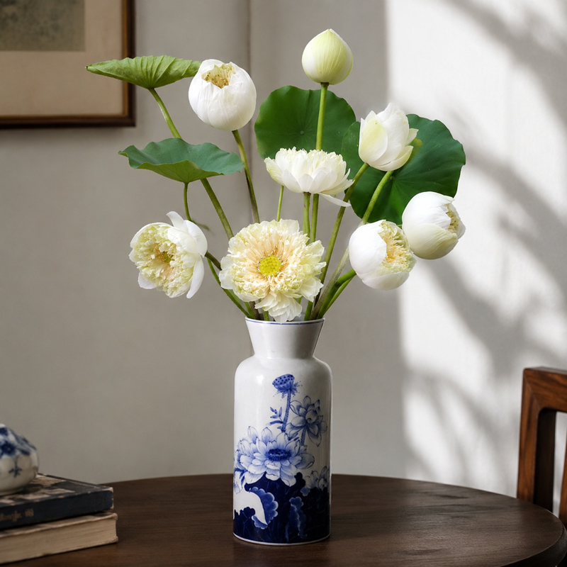 White Lotus Flowers in a Blue and White Ceramic Vase for Classic Table Decor