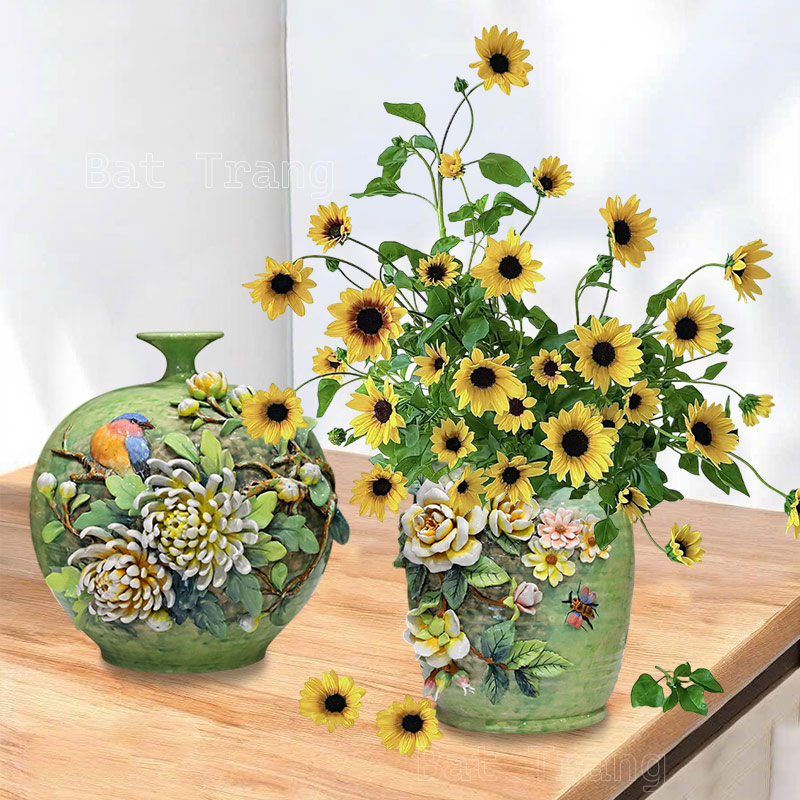 Artistic green ceramic flower vases featuring hand-applied 3D yellow sunflower designs.
