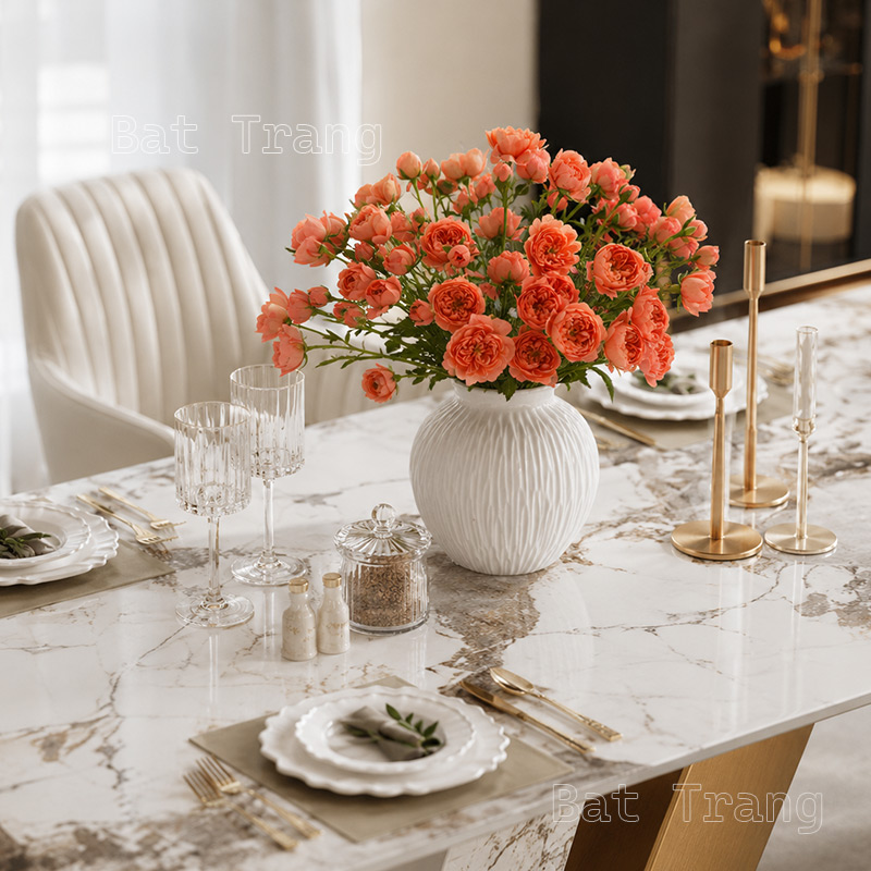 Round white ceramic vase with orange roses for a rectangular dining table